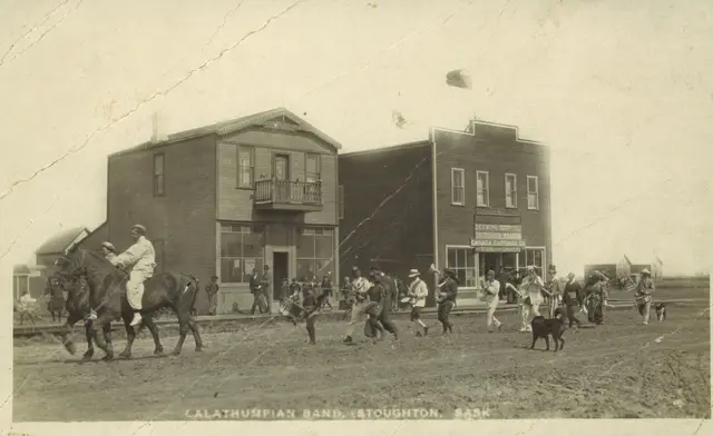 Calathumpian Band parading down the street in Stoughton
